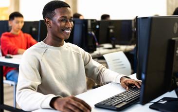 Young African American man working at desktop
